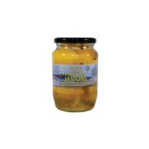 Preserved lemons in a glass jar, ideal for cooking and flavoring dishes. Organic, high-quality prese.