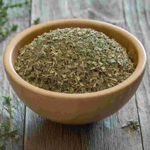 Mixed herbs in a bowl, ideal for culinary use and flavor enhancement.